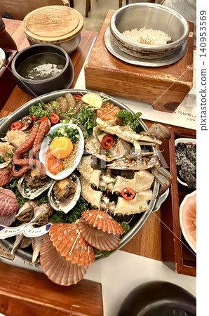 Luxurious Seafood Platter Korean Set Meal | A luxurious gourmet table featuring abalone, crab, and scallops Luxurious Seafood Platter Korean Set Meal | A luxurious gourmet table featuring abalone, crab, and scallops 140953569
