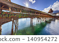 Chapel Bridge with Flowers and Water Tower in Lucerne Switzerland 140954272
