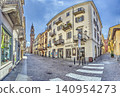 Historic Street Leading to Bell Tower in Vercelli Italy 140954273