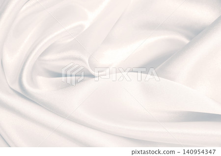 Smooth elegant grey silk or satin luxury cloth as wedding background. Luxurious background design Smooth elegant grey silk or satin luxury cloth as wedding background. Luxurious background design 140954347