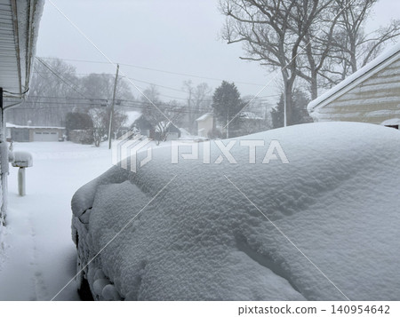 Heavy Snow Covers Parked Car During Winter Storm in Suburb Heavy Snow Covers Parked Car During Winter Storm in Suburb 140954642