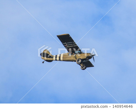 Historic Aircraft Flying in the Blue Sky 140954646