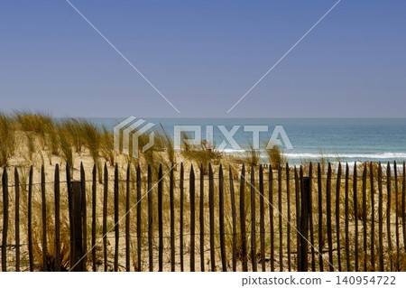 Ocean View With Grass and Fence Near Sandy Beach Ocean View With Grass and Fence Near Sandy Beach 140954722