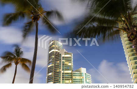 City downtown with skyscraper. Office building in business district. Hiding in palm tree. Skyscraper building architecture. Business skyscraper structure. Modern structural building. Skyscraper city City downtown with skyscraper. Office building in business district. Hiding in palm tree. Skyscraper building architecture. Business skyscraper structure. Modern structural building. Skyscraper city 140954782