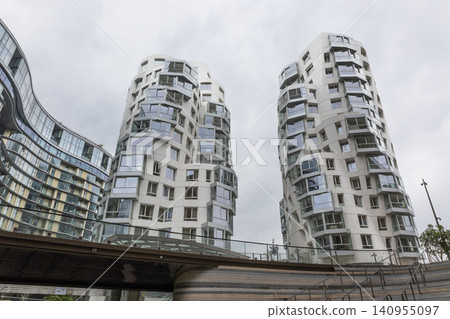 Urban apartment buildings with unique architectural design Urban apartment buildings with unique architectural design 140955097
