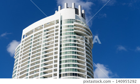 Apartment hotel building. Low angle view of building. Residential building architecture. Architectural exterior detail. Residential house modern exterior. Modern apartment building. Copy space Apartment hotel building. Low angle view of building. Residential building architecture. Architectural exterior detail. Residential house modern exterior. Modern apartment building. Copy space 140955292
