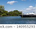 Luxurious life. Vacation on summer. Docked yacht at private area. Boat trip. Copy space. Sea vacation on summer. Luxury boat motor yacht in marina. Luxury yacht. Boating and yachting tourism 140955293