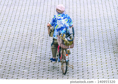 A grandmother in Yokohama, Japan, is seen energetically speeding along with a mobility scooter loaded onto the back of her car! ...Aging society = Yokohama city A grandmother in Yokohama, Japan, is seen energetically speeding along with a mobility scooter loaded onto the back of her car! ...Aging society = Yokohama city 140955320