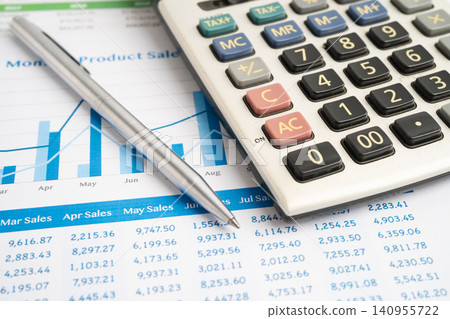 Calculator with pen on data business graphs paper. Calculator with pen on data business graphs paper. 140955722