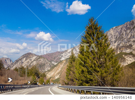 Driving a car on mountain winding road in National park Picos de Europa. Cantabria, Spain, Europe Driving a car on mountain winding road in National park Picos de Europa. Cantabria, Spain, Europe 140956148