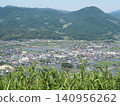 View of a rural town nestled in the mountains 140956262