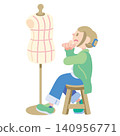 A fashion designer brainstorms ideas in front of a mannequin. 140956771
