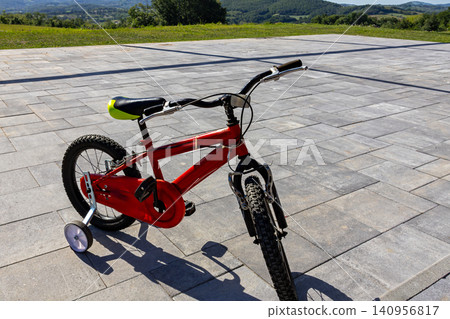 Kids bicycle at home Kids bicycle at home 140956817