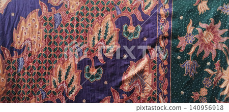 Traditional Indonesian batik fabric patterns featuring floral and geometric motifs. Traditional Indonesian batik fabric patterns featuring floral and geometric motifs. 140956918