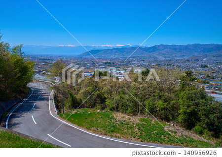 Views of Koshu City, Minami-Alps City, Kofu City, Chuo City, Kai City, and the Southern Alps from Ushioku Miharashi Hill in Yamanashi Prefecture in spring. Views of Koshu City, Minami-Alps City, Kofu City, Chuo City, Kai City, and the Southern Alps from Ushioku Miharashi Hill in Yamanashi Prefecture in spring. 140956926