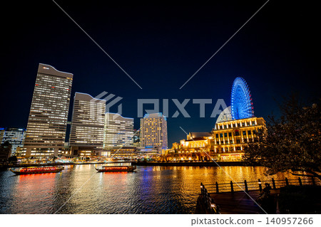 [Kanagawa Prefecture] Yokohama Minato Mirai bustling with cherry blossom viewing boats at night. 140957266