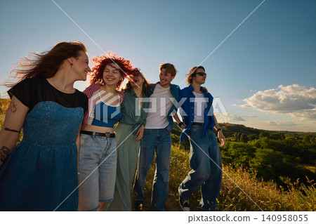 Friends smiling together in golden hour countryside portrait Friends smiling together in golden hour countryside portrait 140958055