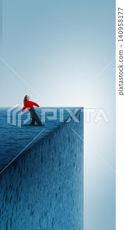 Woman sinking into deep water cube at edge of empty blue space 140958177