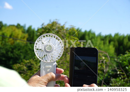Handheld fan, smartphone 140958325