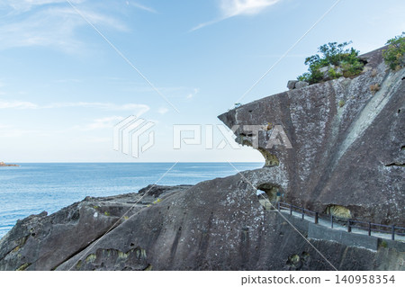 The unique rock formations of Onigajo, a World Heritage Site, and the vast ocean under the summer sky. The unique rock formations of Onigajo, a World Heritage Site, and the vast ocean under the summer sky. 140958354