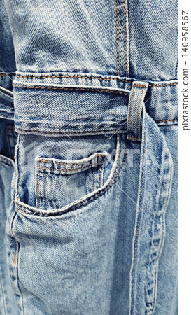 Close-up of blue denim jeans texture background Close-up of blue denim jeans texture background 140958567