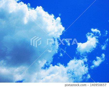 A beautiful scene of early summer blue skies and white clouds. A beautiful scene of early summer blue skies and white clouds. 140958657