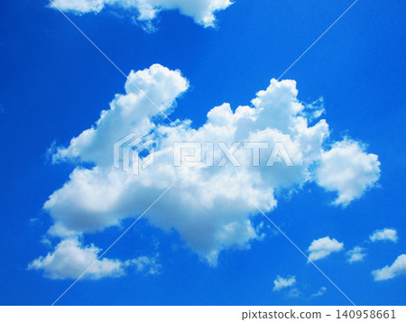 A beautiful scene of early summer blue skies and white clouds. A beautiful scene of early summer blue skies and white clouds. 140958661