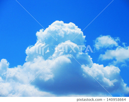 A beautiful scene of early summer blue skies and white clouds. A beautiful scene of early summer blue skies and white clouds. 140958664