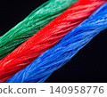 Ultra-thin strands composed of vibrant fibres, isolated against a deep black 140958776