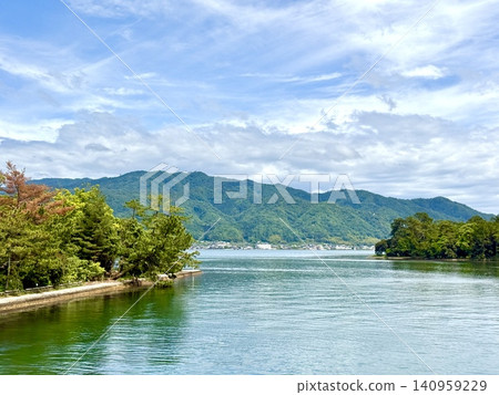An island floating on a lake, a hazy sky, Amanohashidate, Aso Bay side. An island floating on a lake, a hazy sky, Amanohashidate, Aso Bay side. 140959229