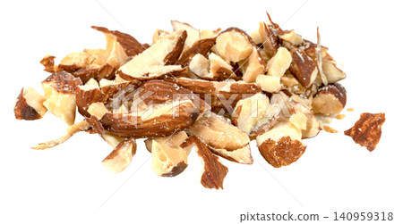Close-up of a pile of chopped and crushed almond pieces isolated. High-quality healthy food ingredient for baking, salads, and snacks. Organic crunchy roasted nut fragments. 140959318