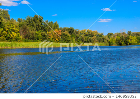 Summer landscape with beautiful river, green trees and blue sky Summer landscape with beautiful river, green trees and blue sky 140959352