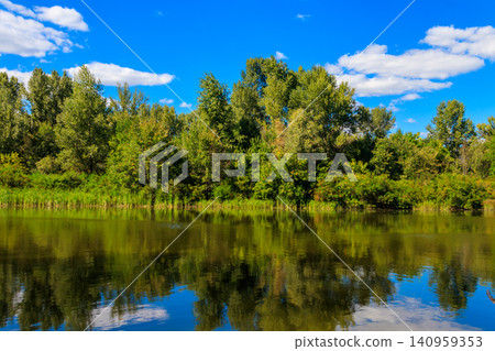 Summer landscape with beautiful river, green trees and blue sky Summer landscape with beautiful river, green trees and blue sky 140959353