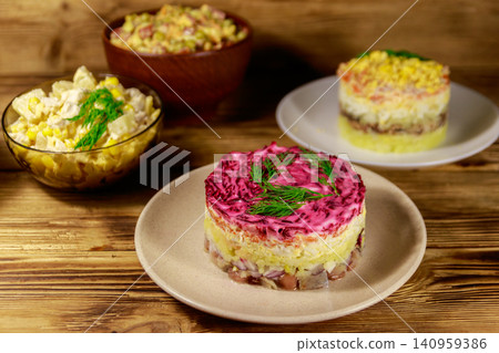 Set of festive mayonnaise salads on wooden table Set of festive mayonnaise salads on wooden table 140959386