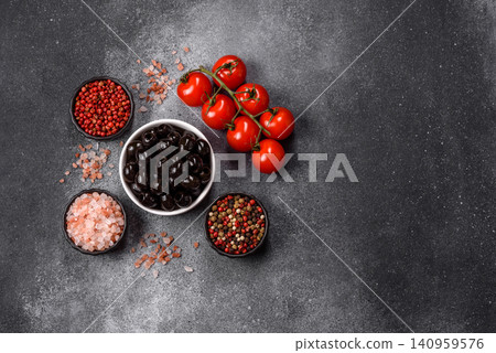 Black canned olives without pits for salads and snacks. Black olives without pits Black canned olives without pits for salads and snacks. Black olives without pits 140959576