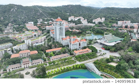 Aerial view of the campus buildings and sports fields of Xiamen University, China. Aerial view of the campus buildings and sports fields of Xiamen University, China. 140959638