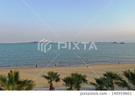 Aerial view of a sandy beach near Xiamen and distant islands. Aerial view of a sandy beach near Xiamen and distant islands. 140959661