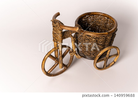 Rattan planters designed like a scooter placed on a white background Rattan planters designed like a scooter placed on a white background 140959688