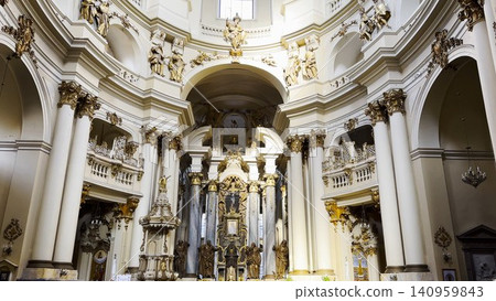 Interior view of a beautiful church showcasing ornate architecture, high ceilings and detailed decorations. Sacred space emphasizing the atmosphere of peace, spirituality and historical character 140959843