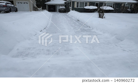 Snow Covers Driveway in Residential Neighborhood During Winter Storm Snow Covers Driveway in Residential Neighborhood During Winter Storm 140960272