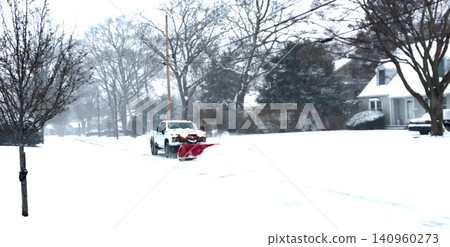 Snow Removal Truck Clears the Road During Heavy Snowfall in Winter 140960273