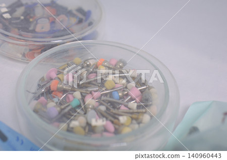 polishing burs, polishers, dental polishers. Dental polishing burs and finishing tools stored in container for restorative dentistry procedures polishing burs, polishers, dental polishers. Dental polishing burs and finishing tools stored in container for restorative dentistry procedures 140960443