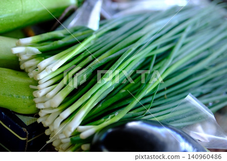 green onions at market. Green Onions and Vibrant Farmer Market Display for Healthy Cooking green onions at market. Green Onions and Vibrant Farmer Market Display for Healthy Cooking 140960486