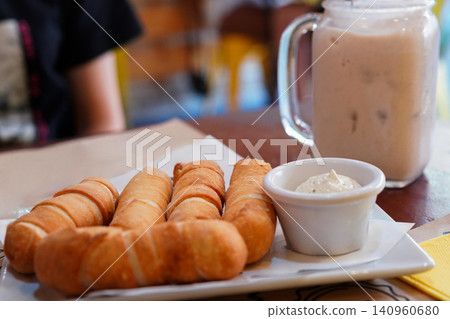Venezuela's traditional fried cheese "Tequeño" and rich milk drink "Cheecha" Venezuela's traditional fried cheese "Tequeño" and rich milk drink "Cheecha" 140960680