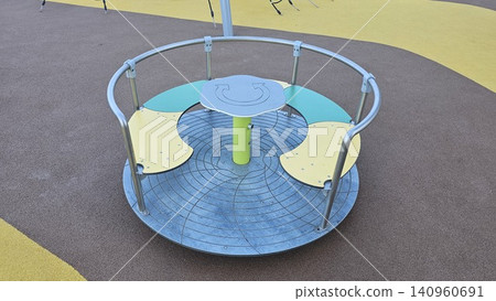 Modern playground with slides, climbing structures, and bridges in a lush, green park setting Modern playground with slides, climbing structures, and bridges in a lush, green park setting 140960691