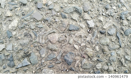 Asphalt Road Texture with Rough Gravel Stones Background Asphalt Road Texture with Rough Gravel Stones Background 140961479