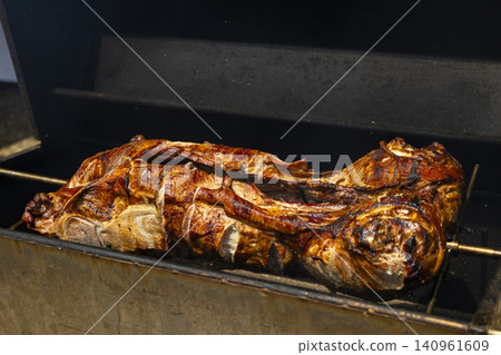 Whole roasted lamb on spit grill Chvalovice Czechia 140961609