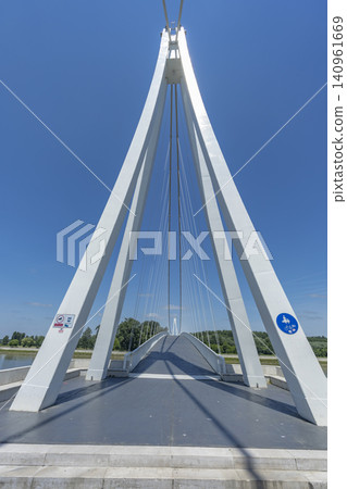 Osijek pedestrian bridge arching across Drava river Osijek pedestrian bridge arching across Drava river 140961669