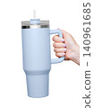 Female Hand Holding 40 oz blue tumbler. Tumbler With Handle, Travel Mug Straw Covers Cup with Lid 140961685
