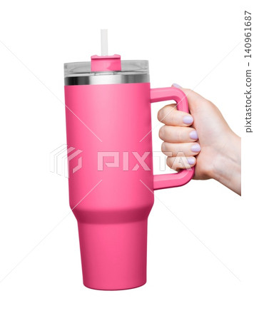 Female Hand Holding 40 oz pink tumbler. Tumbler With Handle, Travel Mug Straw Covers Cup with Lid Female Hand Holding 40 oz pink tumbler. Tumbler With Handle, Travel Mug Straw Covers Cup with Lid 140961687